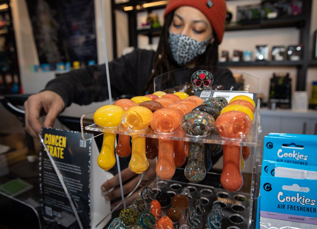 budtender working behind the counter
